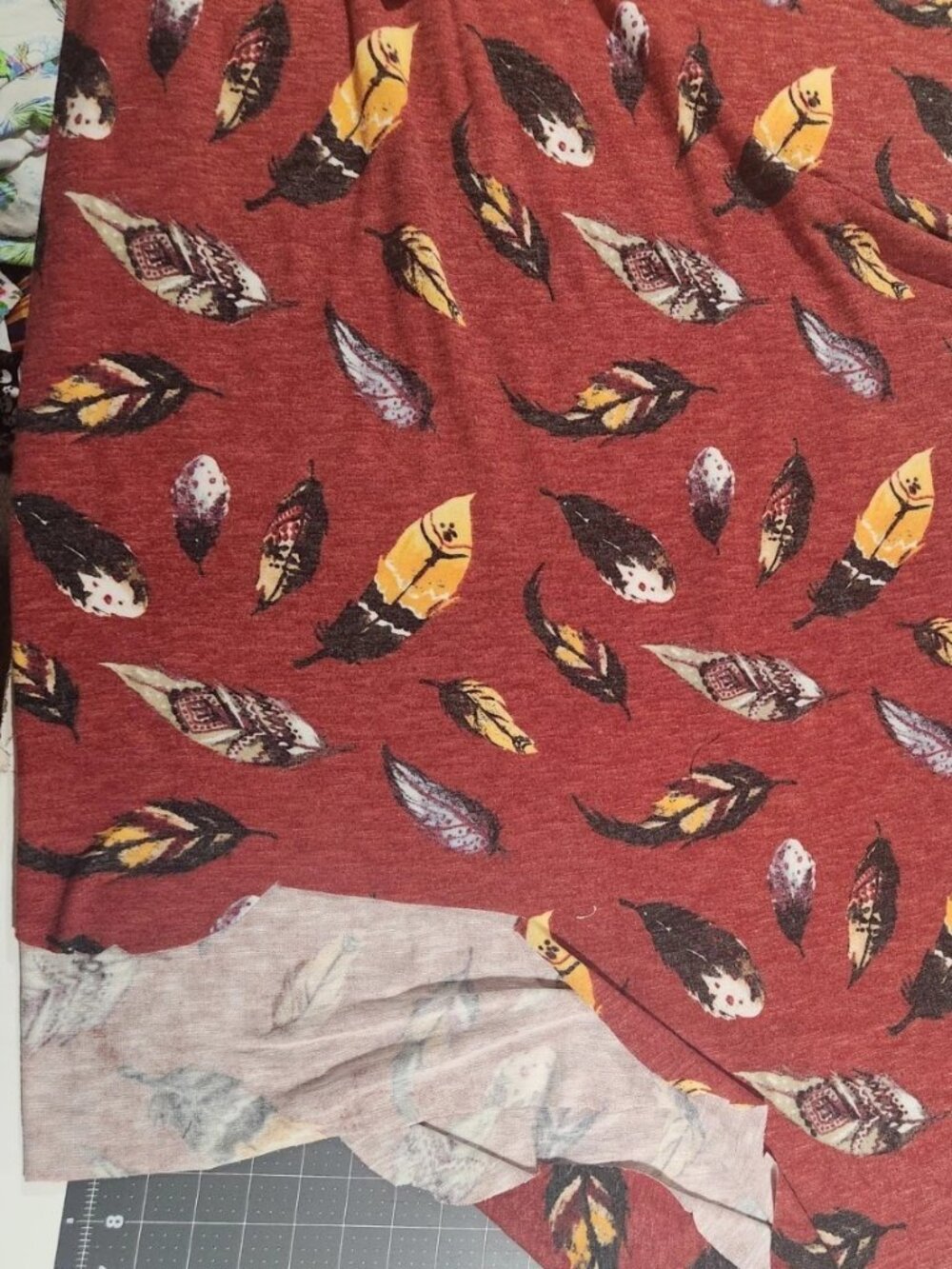 2+ yards Hacci Knit Fabric Reddish-Rust with Feathers ... Beautiful!